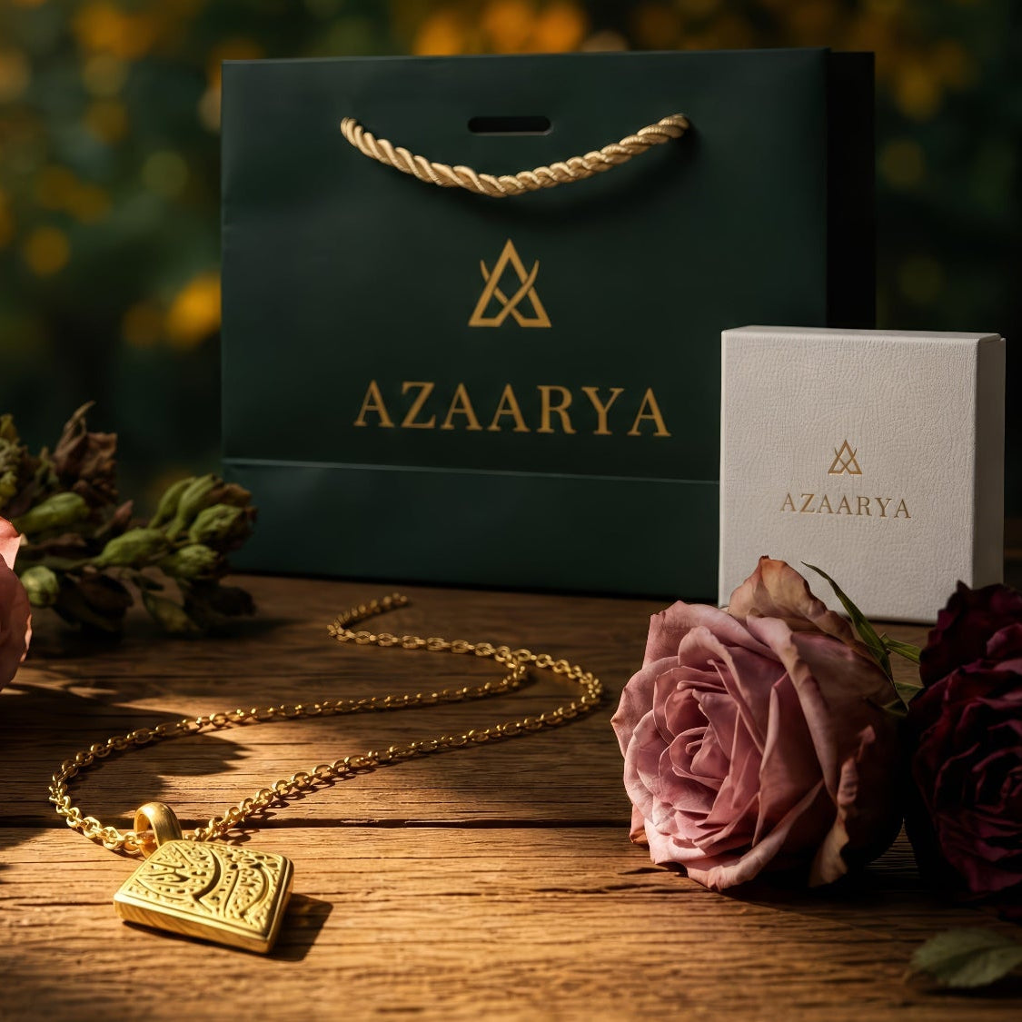 Gold necklace with pendant, Azaarya packaging, and roses on a wooden surface with a blurred natural background.