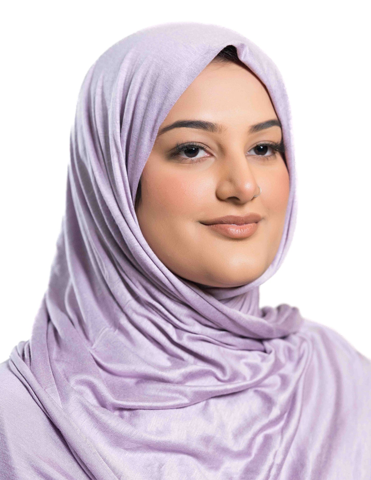 A woman wearing a lilac Hijup showing the full front view with fabric drape and styling details.