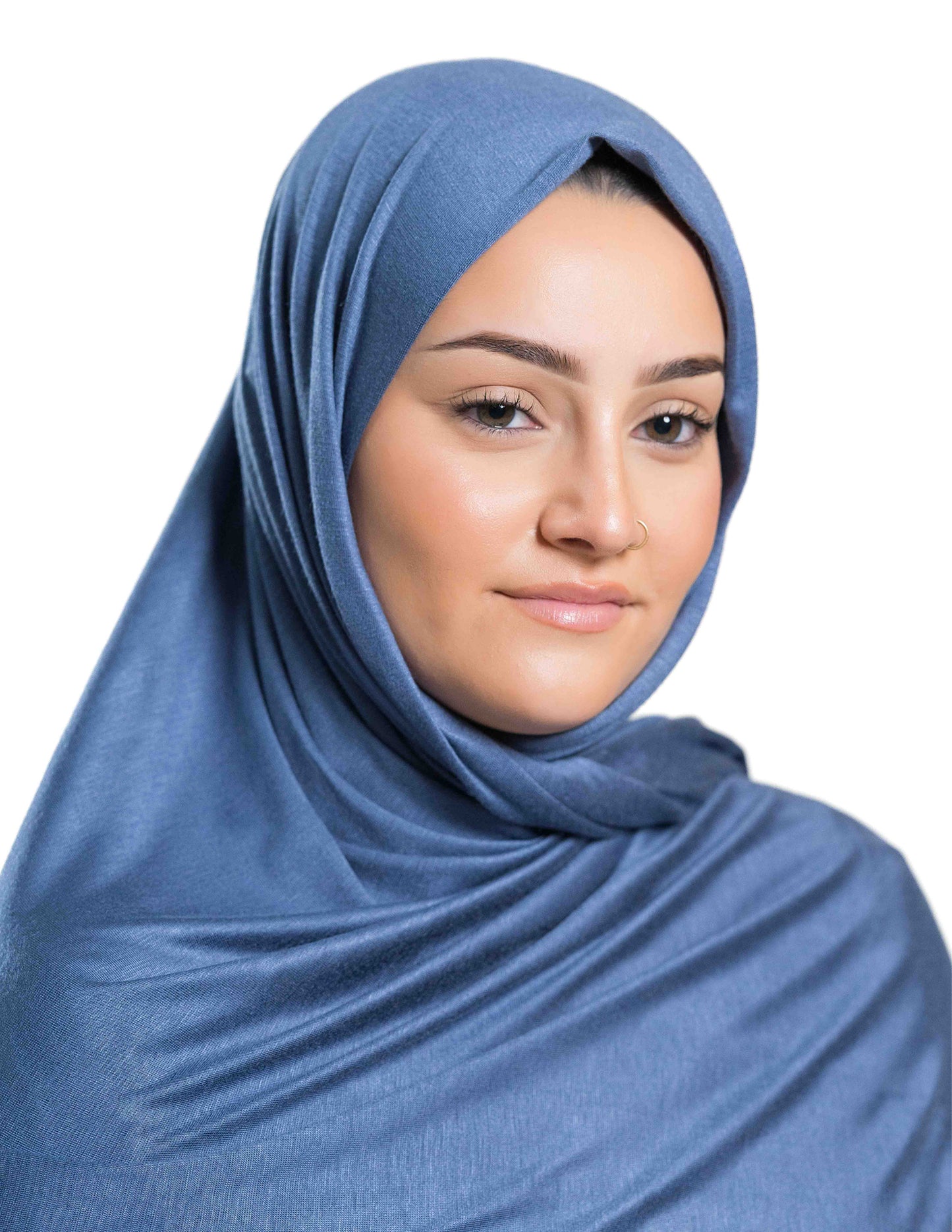 A woman wearing a blue jersey hijab.
