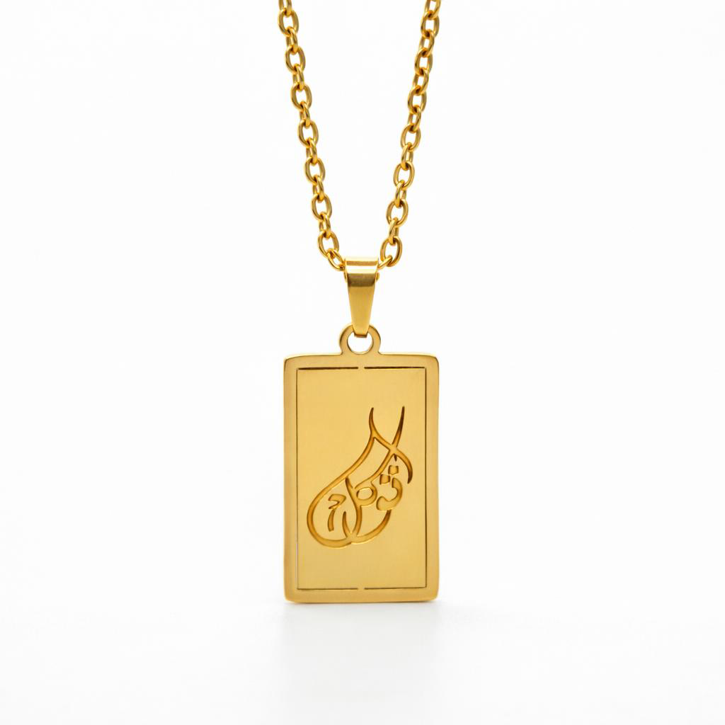 Gold tawakkul necklace with a rectangular pendant on a white background
